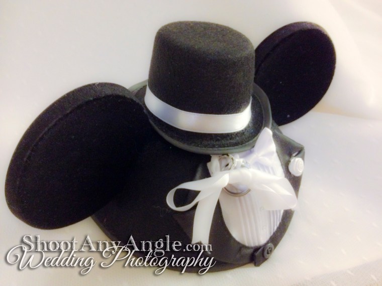 Use an object you already own as the ring bearer pillow. http://shootanyangle.com/weddings/